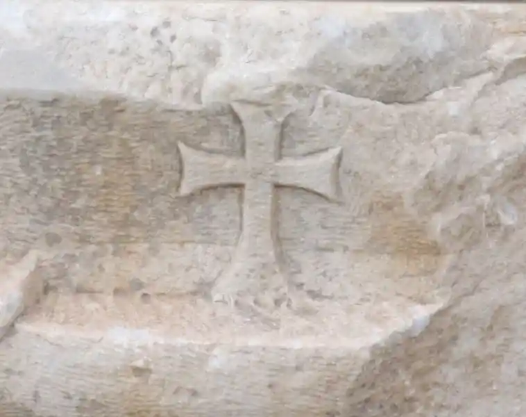 Long cross engraved on what appears to be marble stone in the ruins at the Curetes Street, Ephesus Izmir